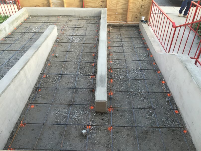 Forms and rebars place next to staircase to prep for concrete pour