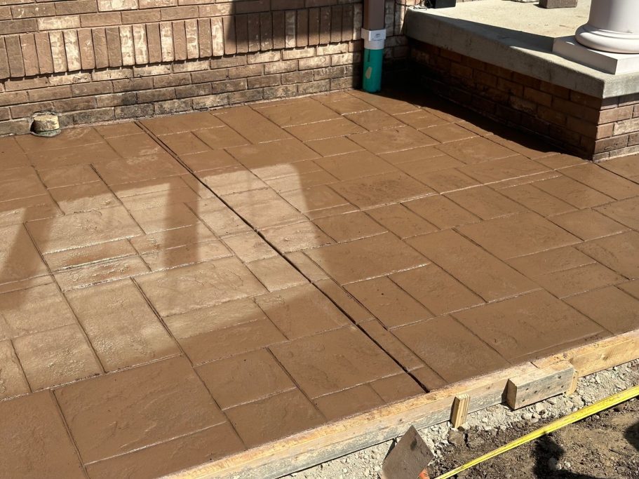 newly poured front patio, complete with a stamped concrete decorative finish 